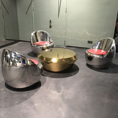 Stainless steel outdoor furniture a set of three stainless steel mirror stools and an electroplated coffee table