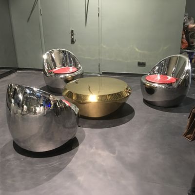 Stainless steel outdoor furniture a set of three stainless steel mirror stools and an electroplated coffee table